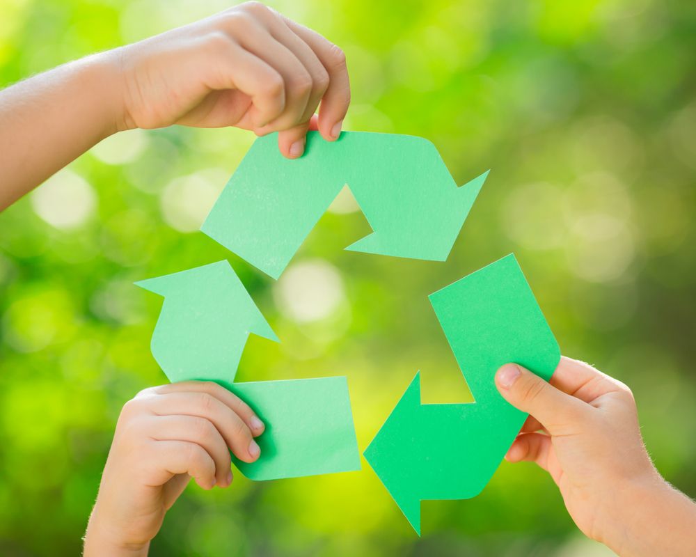 Recycling symbol healed up by children